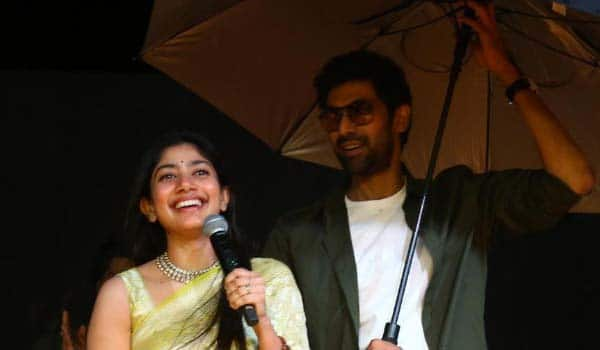 Saipallavi-soaked-in-rain:-Rana-hold-an-umbrella