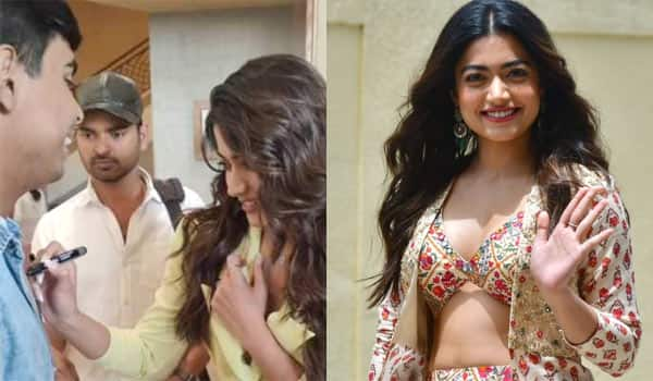 Rashmika-signs-an-autograph-in-fans-chest