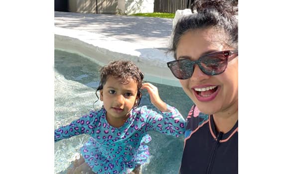 Pooja-Kumar-in-the-swimming-pool-with-her-two-and-a-half-year-old-daughter