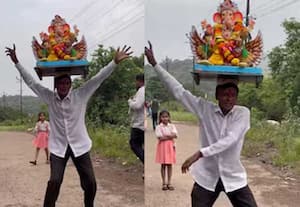 தலையில் விநாயகரை சுமந்து செல்லும் பக்தர்