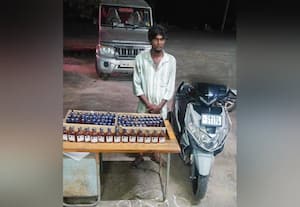 மதுபாட்டில் கடத்தியவர்  கைது