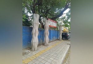 ﻿ நிழற்குடை அமைக்கும் பணி நிறுத்தப்பட்டதால் அதிருப்தி