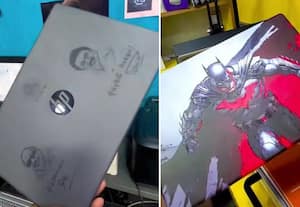   லேப்டாப் பில் கருணாநிதி, ஸ்டாலின் படம்:  ஸ்டிக்கர்  ஒட்டி மறைக்கும் மாணவர்கள்