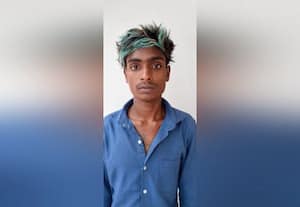  ஓட்டலுக்கு தீ வைத்தவர் கைது