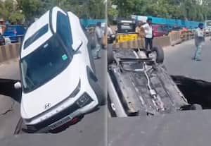 சாலையில் திடீர் ராட்சத பள்ளம்; குப்புற விழுந்த கார்; அதிர்ச்சி வீடியோ